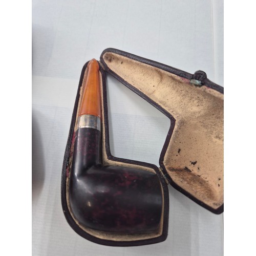 22 - Three Cased Briar Pipes One with Silver Collar & Amber End