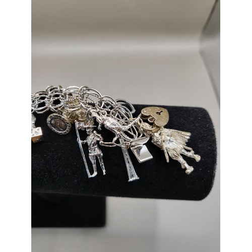 6A - Sterling Silver Charm Bracelet Weighs 91g Has Lots of Charms Measures 18cm Long Unclasped