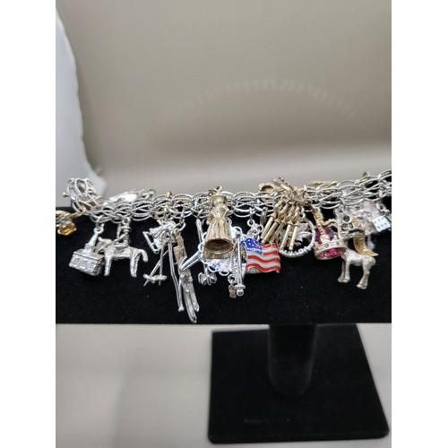 6A - Sterling Silver Charm Bracelet Weighs 91g Has Lots of Charms Measures 18cm Long Unclasped