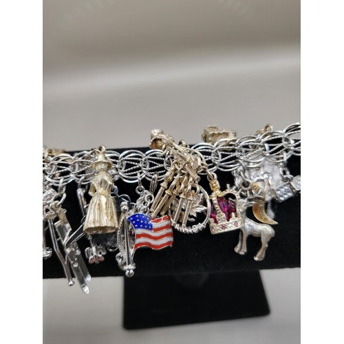 6A - Sterling Silver Charm Bracelet Weighs 91g Has Lots of Charms Measures 18cm Long Unclasped