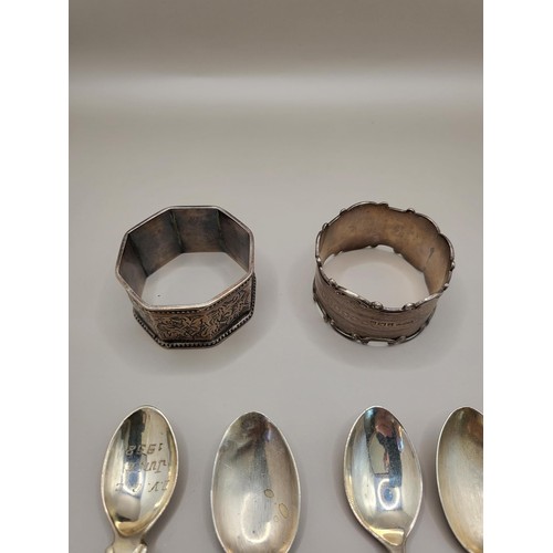 28 - Four Sterling Teaspoons along with Two Sterling Napkin Rings Weighs 99g