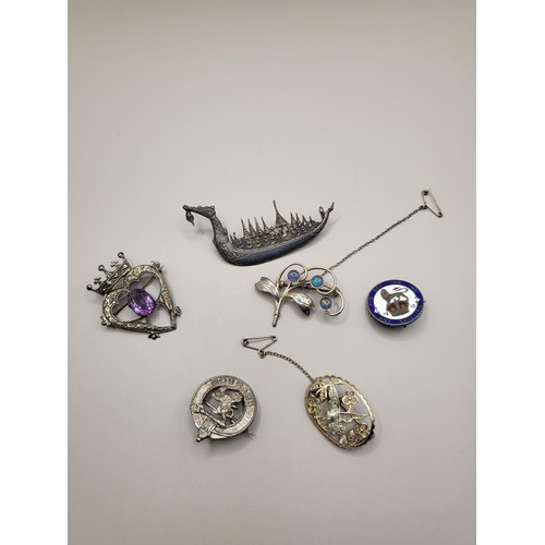 44 - Six Sterling Silver Brooches Very Nice Collection Includes Longboat, Heart with Amethyst, Clan Badge... 