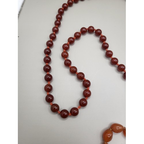 93 - Two Beaded Necklace Light Amber Coloured One Measures 80cm Long if Unclasped The Red One Measures 10... 