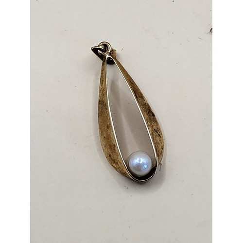 50 - 14ct Pendant with Pearl Weighs 1g on 9ct Gold Chain Weighs 0.6g Both Hallmarked&nbsp;