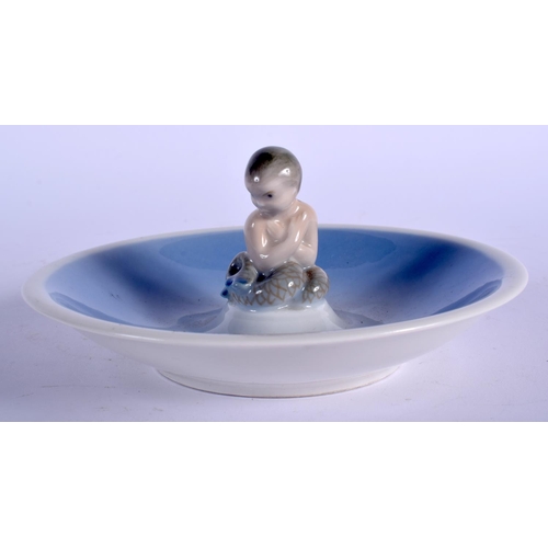 108 - A ROYAL COPENHAGEN PORCELAIN DISH with seated mermaid. 13.5 cm wide.