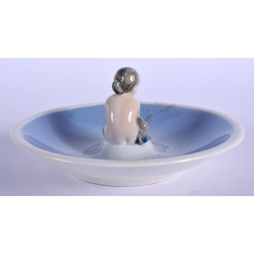 108 - A ROYAL COPENHAGEN PORCELAIN DISH with seated mermaid. 13.5 cm wide.