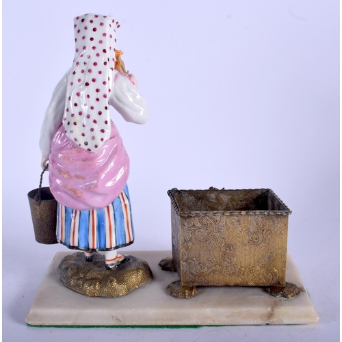 112 - A RARE EARLY 20TH CENTURY RUSSIAN PORCELAIN FIGURE OF A FEMALE modelled beside a brass dish. 17 cm x... 