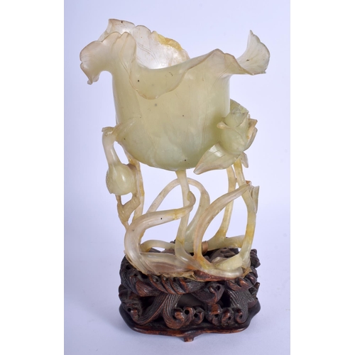 1164 - A LARGE 19TH CENTURY CHINESE CARVED JADE FLOWER GROUP Qing, of openwork form, modelled as a flowerin... 