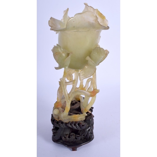 1164 - A LARGE 19TH CENTURY CHINESE CARVED JADE FLOWER GROUP Qing, of openwork form, modelled as a flowerin... 