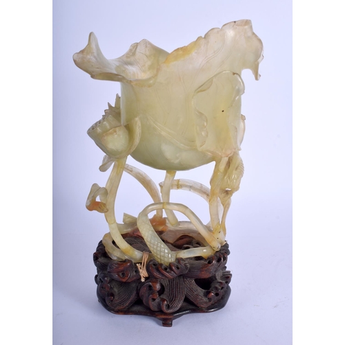 1164 - A LARGE 19TH CENTURY CHINESE CARVED JADE FLOWER GROUP Qing, of openwork form, modelled as a flowerin... 