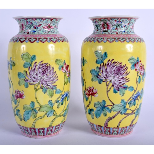 1212 - A PAIR OF CHINESE FAMILLE ROSE PORCELAIN VASES 20th Century, painted with flowers. 17.5 cm high.