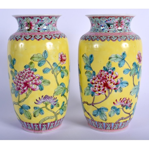 1212 - A PAIR OF CHINESE FAMILLE ROSE PORCELAIN VASES 20th Century, painted with flowers. 17.5 cm high.