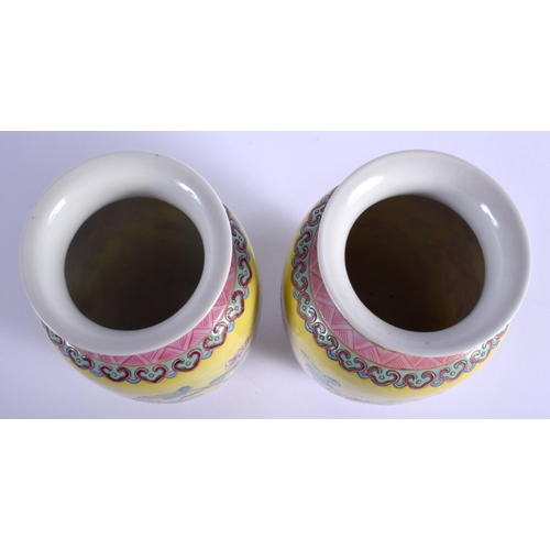 1212 - A PAIR OF CHINESE FAMILLE ROSE PORCELAIN VASES 20th Century, painted with flowers. 17.5 cm high.