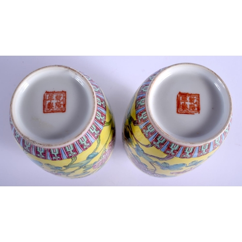 1212 - A PAIR OF CHINESE FAMILLE ROSE PORCELAIN VASES 20th Century, painted with flowers. 17.5 cm high.