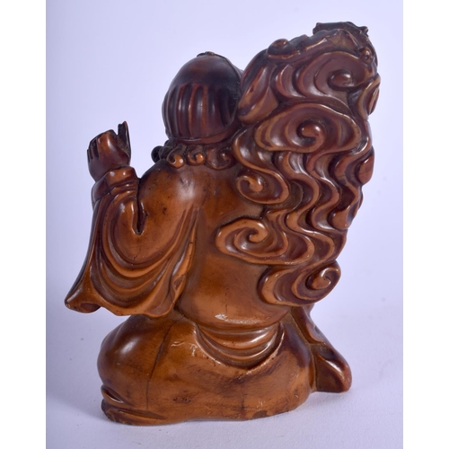 1215 - A 19TH CENTURY CHINESE CARVED SOAPSTONE FIGURE OF AN IMMORTAL Qing, modelled beside a dragon. 9 cm x... 