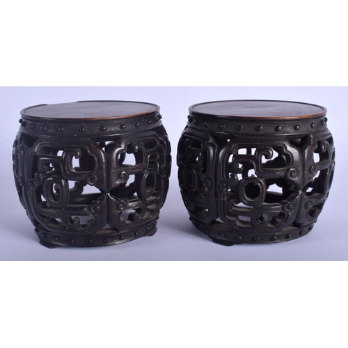 1227 - A RARE PAIR OF 19TH CENTURY CHINESE BARREL SHAPED HONGMU STANDS Qing, possibly zitan. 9 cm x 7 cm.
