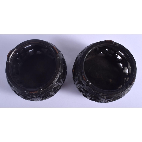 1227 - A RARE PAIR OF 19TH CENTURY CHINESE BARREL SHAPED HONGMU STANDS Qing, possibly zitan. 9 cm x 7 cm.