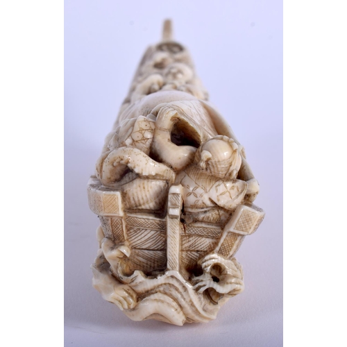 1242 - A 19TH CENTURY JAPANESE MEIJI PERIOD CARVED IVORY OKIMONO modelled as figures beside an octopus. 17 ... 