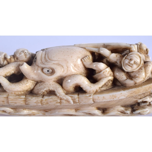 1242 - A 19TH CENTURY JAPANESE MEIJI PERIOD CARVED IVORY OKIMONO modelled as figures beside an octopus. 17 ... 