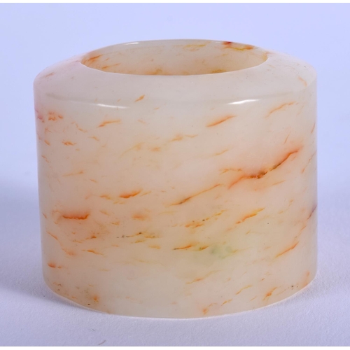 1250 - A 19TH CENTURY CHINESE CARVED GREYISH WHITE JADE ARCHERS Qing, with red inclusions. 2.75 cm wide.