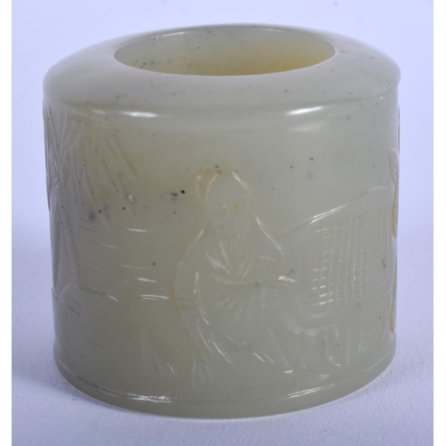 1251 - A 19TH CENTURY CHINESE CARVED GREEN JADE ARCHERS RING Qing, decorated with figures within landscapes... 