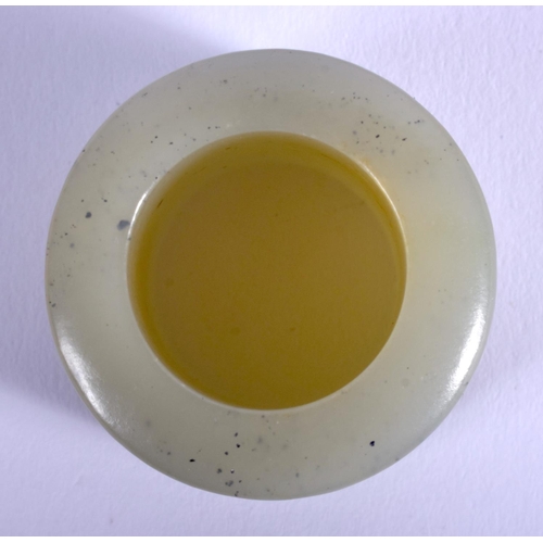 1251 - A 19TH CENTURY CHINESE CARVED GREEN JADE ARCHERS RING Qing, decorated with figures within landscapes... 