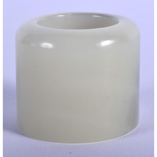 1255 - AN EARLY 20TH CENTURY CHINESE CARVED GREYISH GREEN JADE ARCHERS RING Late Qing/Republic. 3 cm wide.