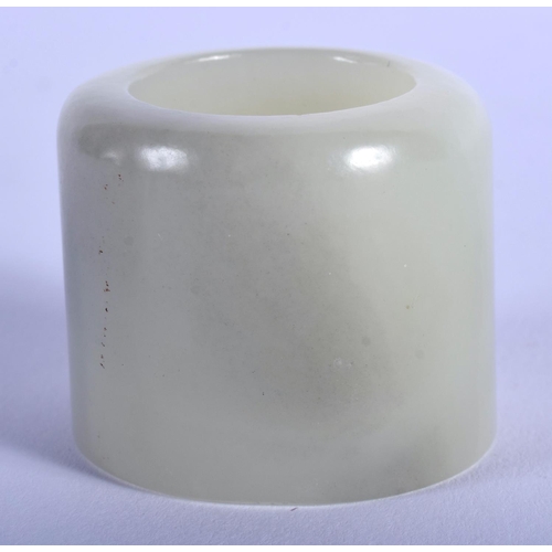 1255 - AN EARLY 20TH CENTURY CHINESE CARVED GREYISH GREEN JADE ARCHERS RING Late Qing/Republic. 3 cm wide.