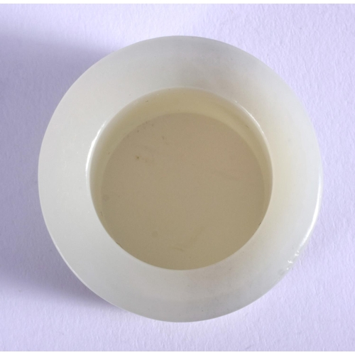 1255 - AN EARLY 20TH CENTURY CHINESE CARVED GREYISH GREEN JADE ARCHERS RING Late Qing/Republic. 3 cm wide.