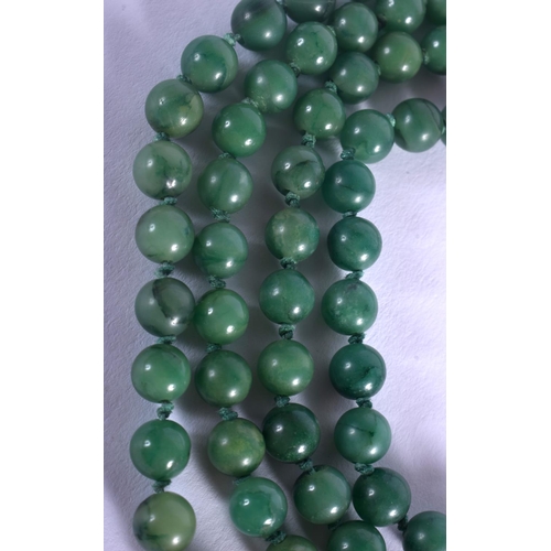 1256 - AN EARLY 20TH CENTURY CHINESE CARVED JADEITE AND GREEN JADE NECKLACE Late Qing/Republic. Pendant 4 c... 