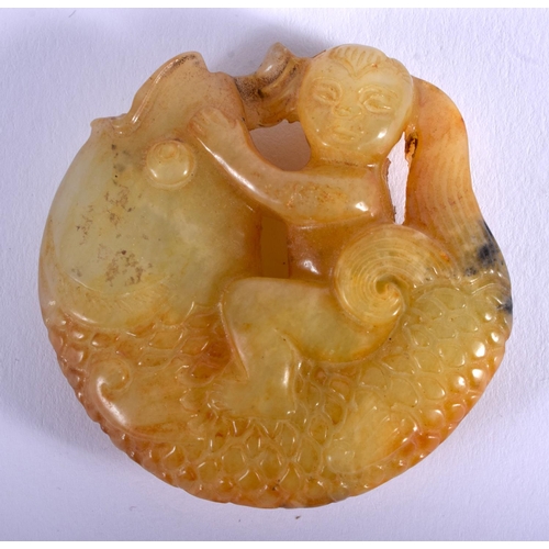 1262 - AN UNUSUAL 19TH CENTURY CHINESE CARVED YELLOW JADE CARP Qing, modelled with a boy riding upon it. 4.... 