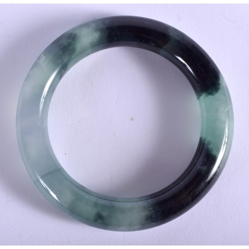 1270 - AN EARLY 20TH CENTURY CHINESE CARVED ICEY JADEITE BANGLE Late Qing/Republic. 8 cm diameter.