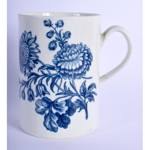 128 - Worcester cylindrical mug printed with flower sprays including a rose. 12 cm high.