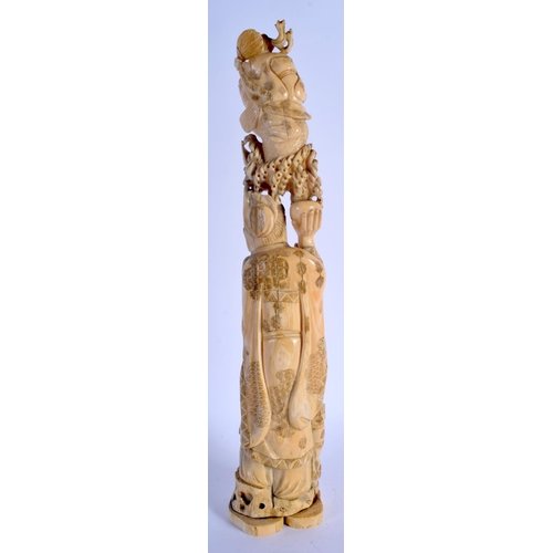 1282 - A LARGE 19TH CENTURY JAPANESE MEIJI PERIOD CARVED IVORY OKIMONO modelled as a male holding aloft a l... 