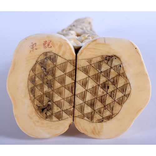 1282 - A LARGE 19TH CENTURY JAPANESE MEIJI PERIOD CARVED IVORY OKIMONO modelled as a male holding aloft a l... 