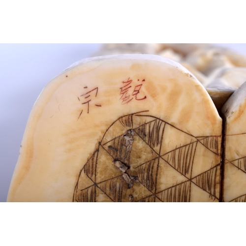 1282 - A LARGE 19TH CENTURY JAPANESE MEIJI PERIOD CARVED IVORY OKIMONO modelled as a male holding aloft a l... 