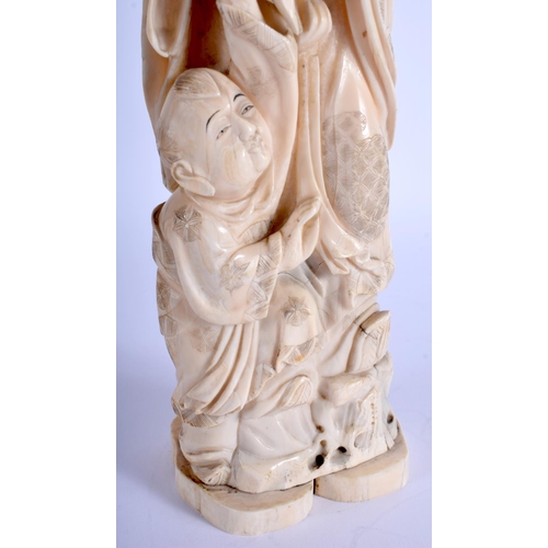 1282 - A LARGE 19TH CENTURY JAPANESE MEIJI PERIOD CARVED IVORY OKIMONO modelled as a male holding aloft a l... 