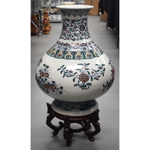 1289 - AN EARLY 20TH CENTURY CHINESE DOUCAI PORCELAIN HU VASE Late Qing/Republic, bearing Yongzheng marks t... 