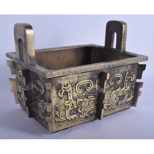 1301 - A LARGE 19TH CENTURY CHINESE TWIN HANDLED BRONZE CENSER Qing, of archaic form, decorated with mask h... 