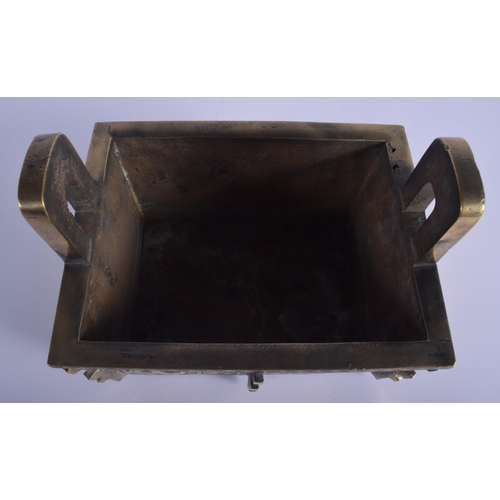 1301 - A LARGE 19TH CENTURY CHINESE TWIN HANDLED BRONZE CENSER Qing, of archaic form, decorated with mask h... 