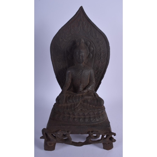 1311 - AN EARLY 20TH CENTURY CHINESE IRON FIGURE OF A BUDDHA modelled holding a stupa upon an openwork base... 