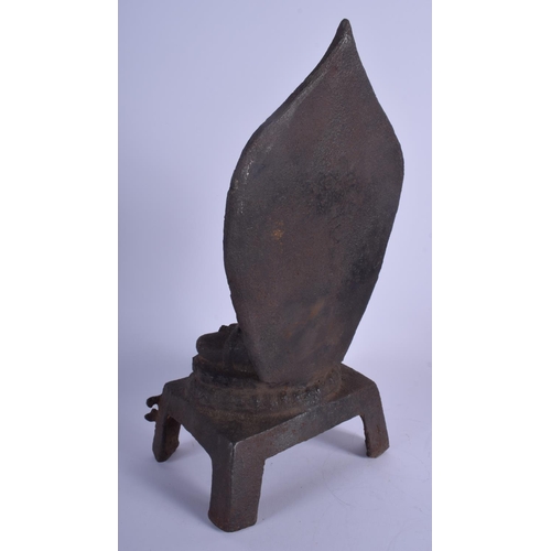 1311 - AN EARLY 20TH CENTURY CHINESE IRON FIGURE OF A BUDDHA modelled holding a stupa upon an openwork base... 