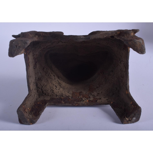 1311 - AN EARLY 20TH CENTURY CHINESE IRON FIGURE OF A BUDDHA modelled holding a stupa upon an openwork base... 