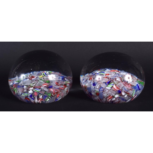 19 - A NEAR PAIR OF ANTIQUE FRENCH PAPERWEIGHTS probably Clichy or Baccarat. 7.25 cm wide.