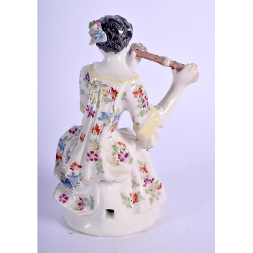 204 - Bow figure of a female musician  seated and playing the flute wearing a flowered dress raised on a p... 