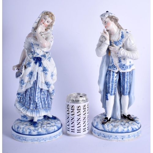 220 - A LARGE PAIR OF 19TH CENTURY GERMAN PORCELAIN FIGURES probably Meissen, painted with blue and white ... 