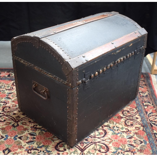 234 - AN ANTIQUE TRAVELLING BOX with domed leather top. 51 cm x 60 cm.
