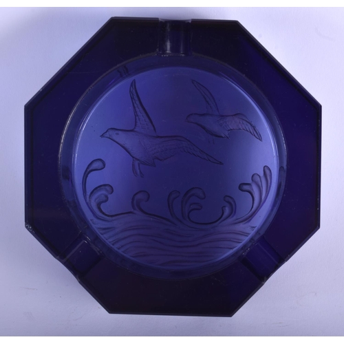 25 - AN ANTIQUE PURPLE GLASS ASHTRAY decorated with birds. 12.5 cm wide.