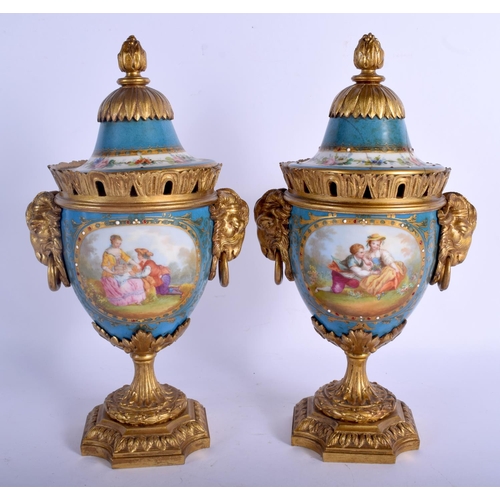 299 - A PAIR OF 19TH CENTURY FRENCH SEVRES PORCELAIN VASES AND COVERS with gilt bronze fittings. 29 cm x 1... 