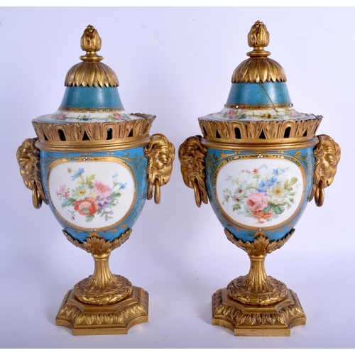 299 - A PAIR OF 19TH CENTURY FRENCH SEVRES PORCELAIN VASES AND COVERS with gilt bronze fittings. 29 cm x 1... 